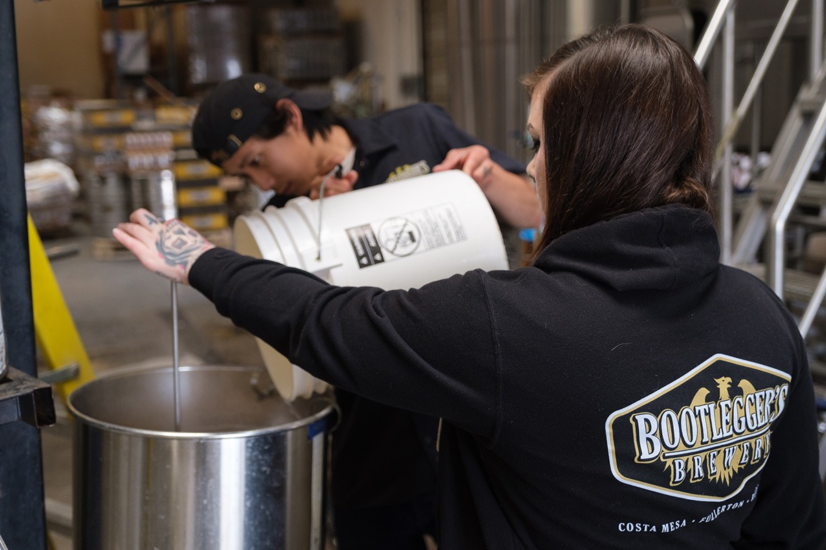 adding ingredients to a batch